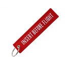 Keychain Insert Before Flight in red with white text